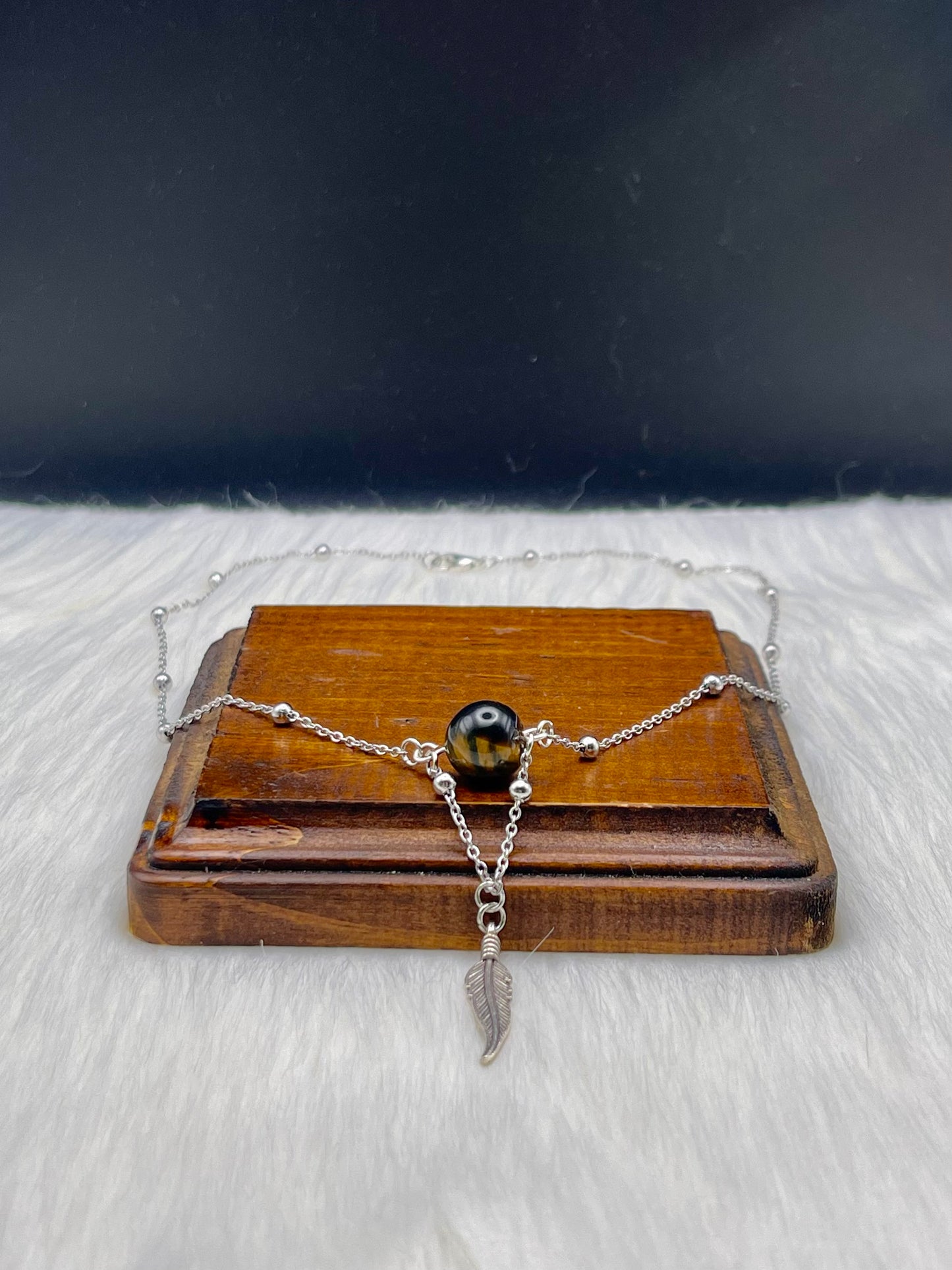 Elegant Handcrafted Tigers Eye Necklace with Feather Charm on a Stainless Steel Chain