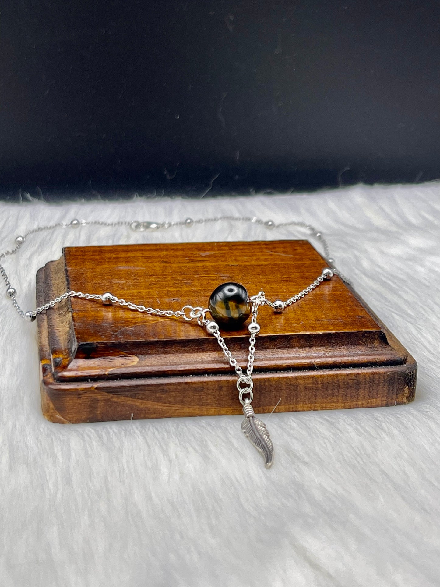 Elegant Handcrafted Tigers Eye Necklace with Feather Charm on a Stainless Steel Chain