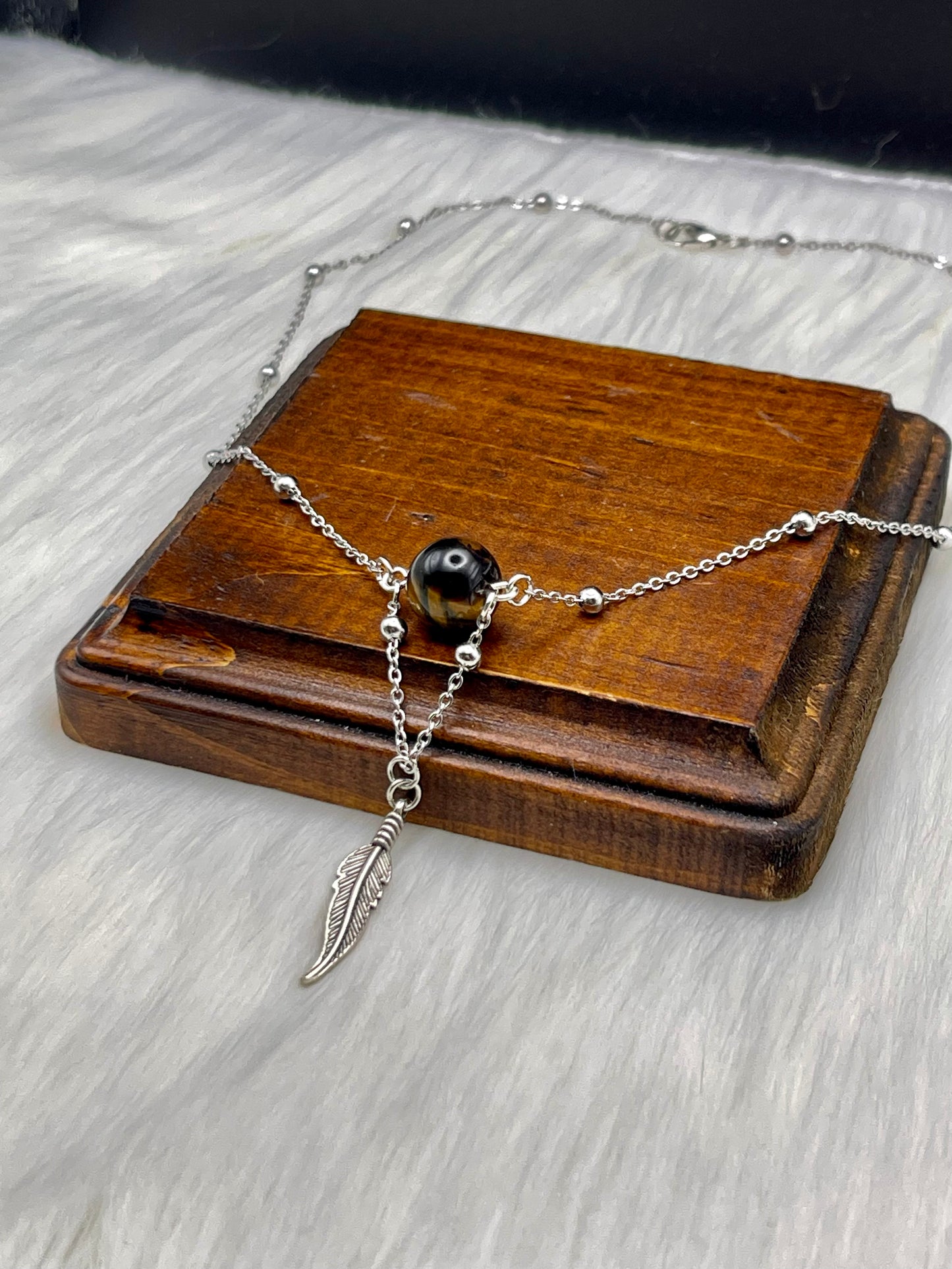 Elegant Handcrafted Tigers Eye Necklace with Feather Charm on a Stainless Steel Chain