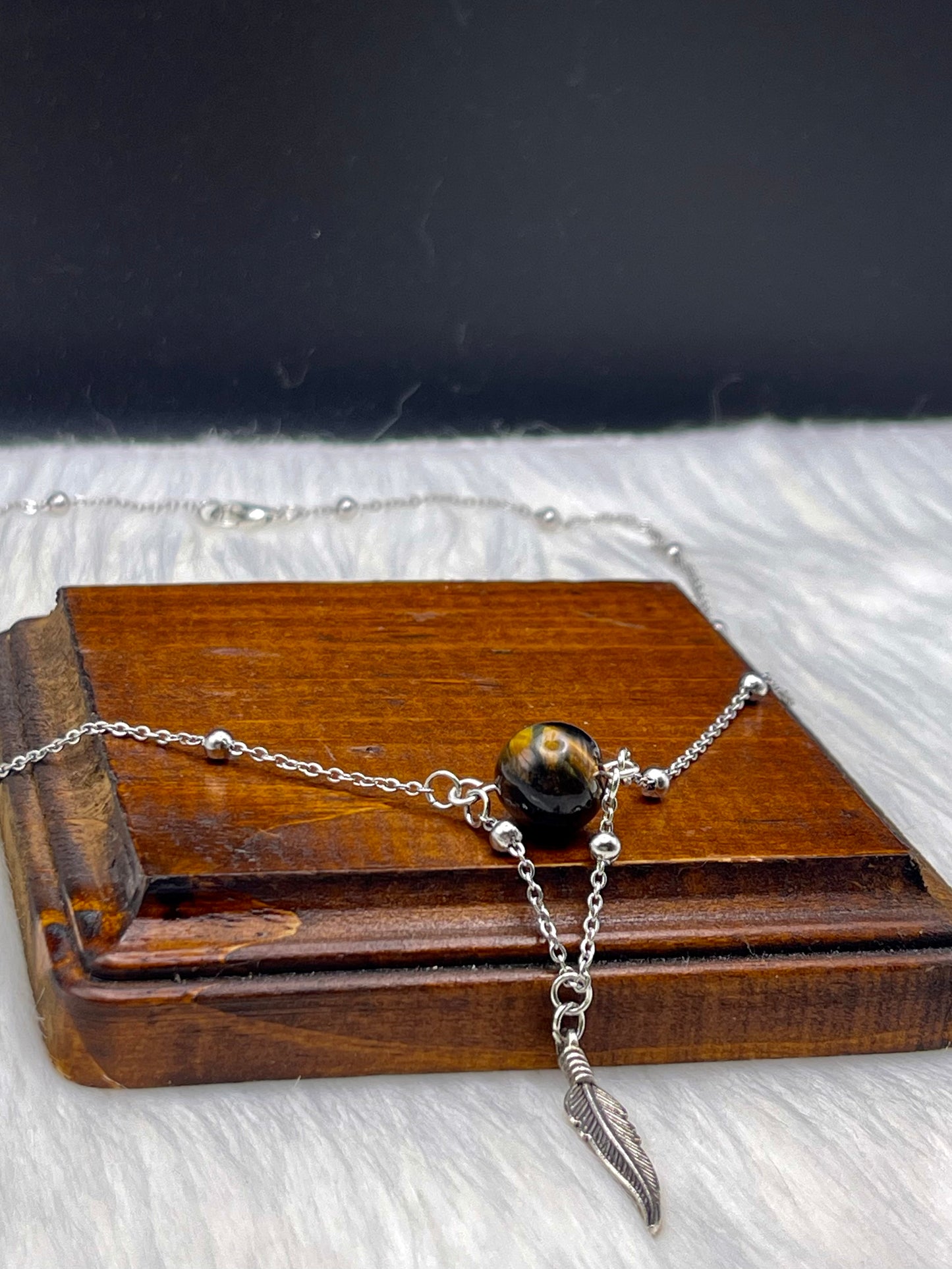 Elegant Handcrafted Tigers Eye Necklace with Feather Charm on a Stainless Steel Chain